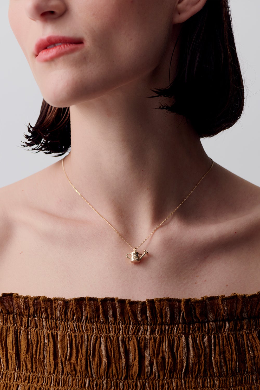 karen walker watering can necklace